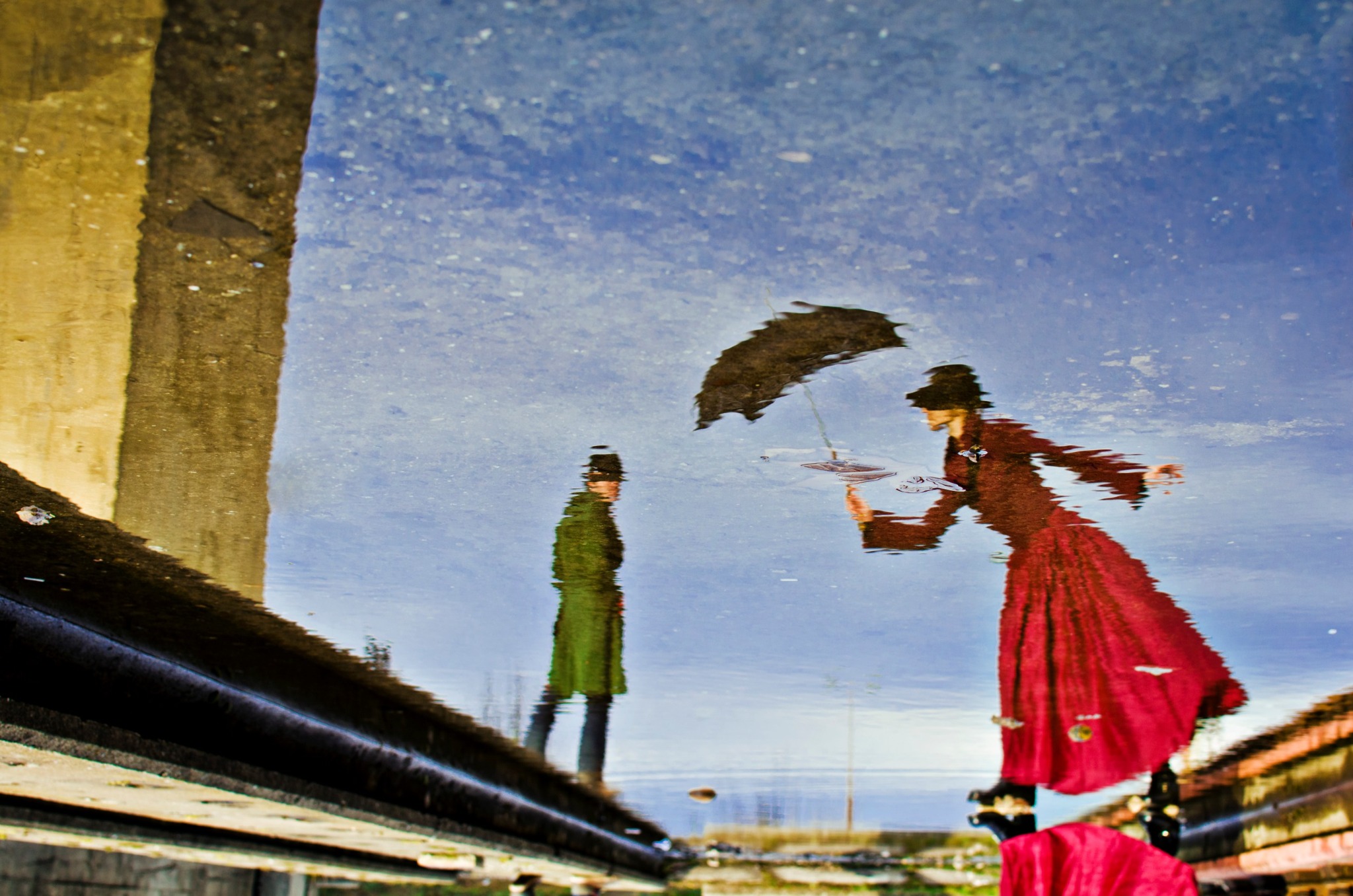 Figures reflected in water
